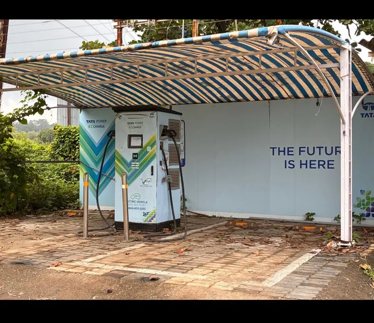Covered Tata Power EZ Charge point with a dedicated bay